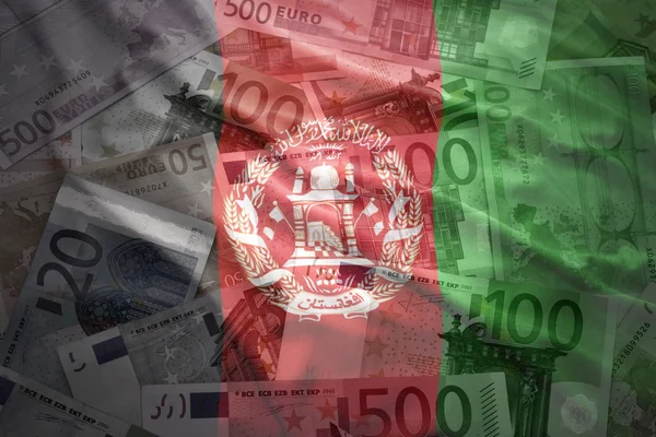 Colorido ondeando bandera de Afganistán sobre un fondo de dinero en euros —  Fotos de Stock