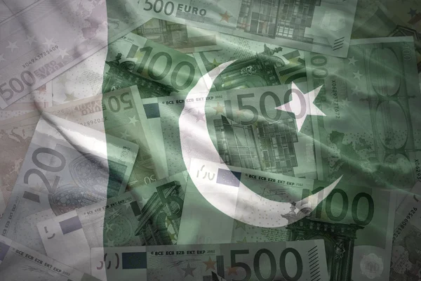 Colorful waving pakistani flag on a euro money background — Stock fotografie