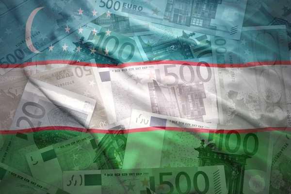Colorful waving uzbekistan flag on a euro money background — Stok fotoğraf