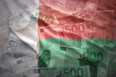 colorful waving madagascar flag on a euro money background
