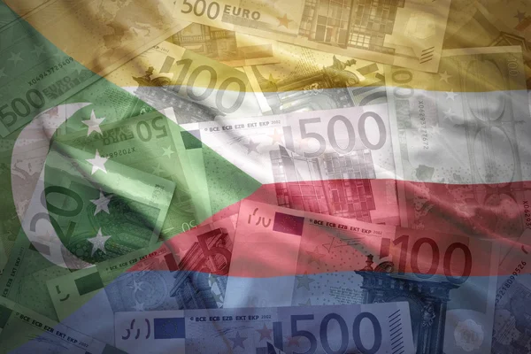 Colorful waving comoros flag on a euro money background — Stok fotoğraf