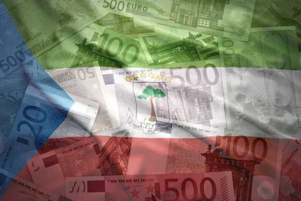 Colorful waving equatorial guinea flag on a euro money background — Stok fotoğraf