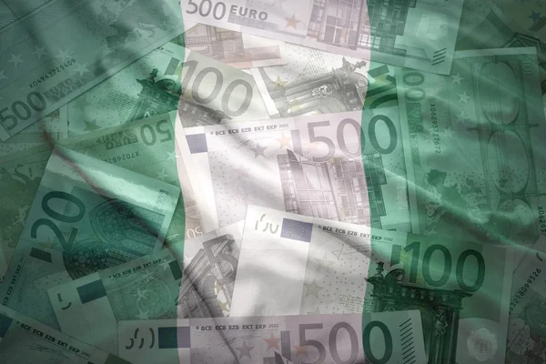 Colorful waving nigerian flag on a euro money background — Stock Photo, Image