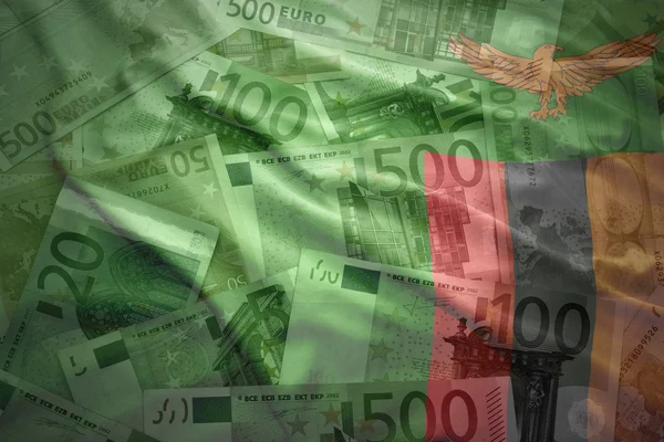 Colorful waving zambian flag on a euro money background — Stock Photo, Image