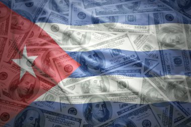 colorful waving cuban flag on a american dollar money background