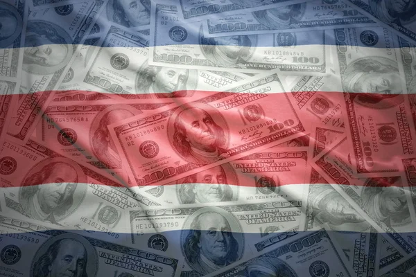 Colorful waving costa rican flag on a american dollar money background — Stock Photo, Image