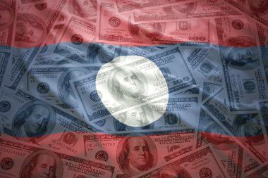 colorful waving laotian flag on a american dollar money background