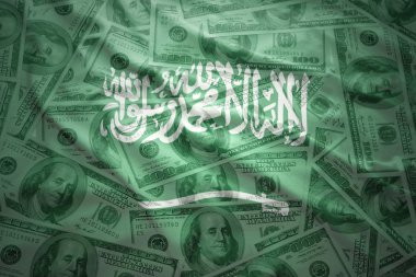 colorful waving saudi arabia flag on a american dollar money background