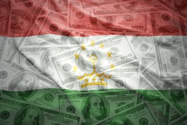 colorful waving tajik flag on a american dollar money background