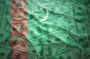 colorful waving  turkmen flag on a american dollar money background