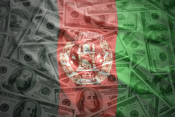 Colorful waving afghan flag on a american dollar money background — Stok fotoğraf