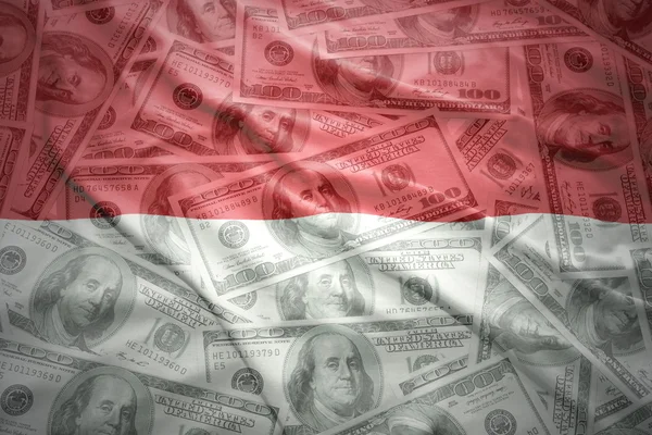 Colorful waving indonesian flag on a american dollar money background — Stok fotoğraf