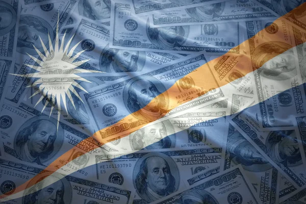 Colorful waving Marshall Islands flag on a american dollar money background — Stock Photo, Image