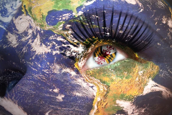 Womans face with planet Earth texture and maryland state flag inside the eye. — Stock Photo, Image