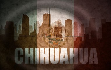 sniper scope aimed at the abstract silhouette of the city with text Chihuahua at the vintage mexican flag