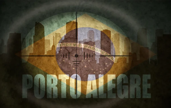 Sniper scope aimed at the abstract silhouette of the city with text Porto Alegre at the vintage brazilian flag — Stock Photo, Image