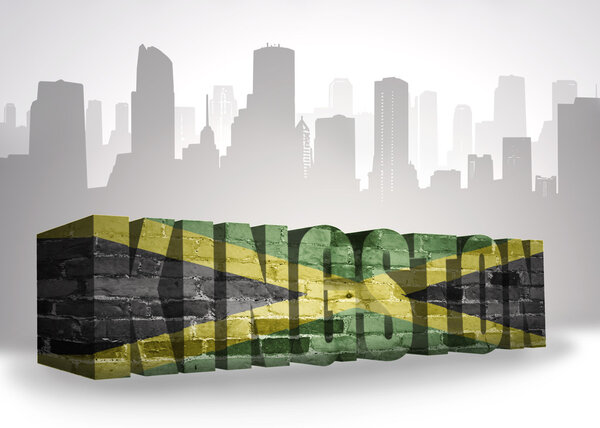 text kingston with national flag of jamaica near abstract silhouette of the city 