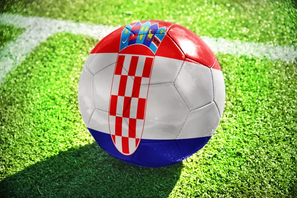 Football ball with the national flag of croatia  on the field — ストック写真