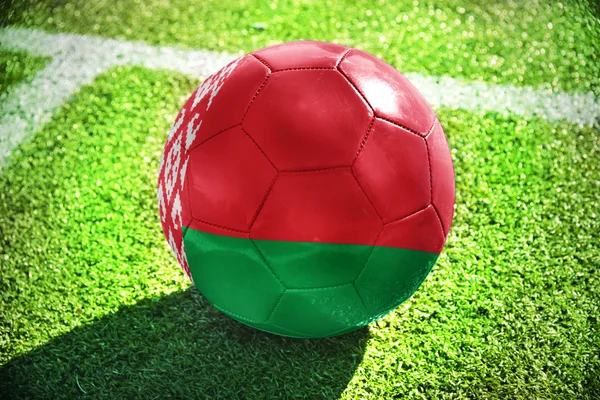 Football ball with the national flag of belarus on the field — Zdjęcie stockowe