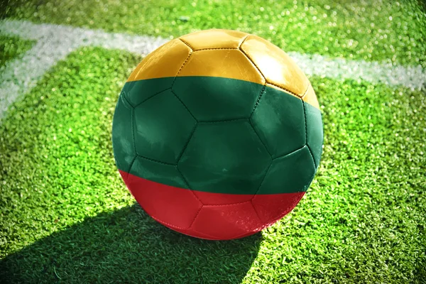 Football ball with the national flag of lithuania on the field — Zdjęcie stockowe