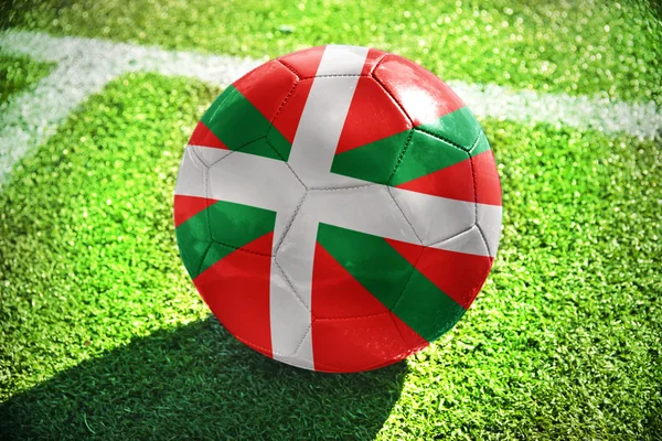 Football ball with the national flag of basque country on the field Stockbild