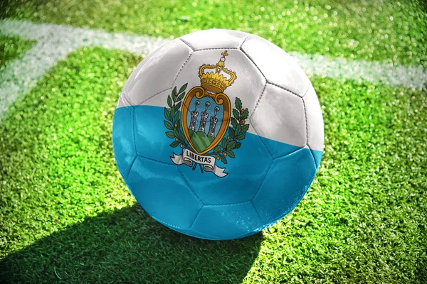 Football ball with the national flag of San Marino on the field — Stock Photo, Image