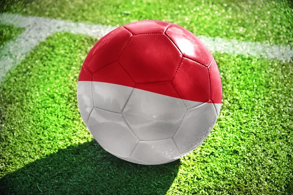 Football ball with the national flag of indonesia — Stock Photo, Image