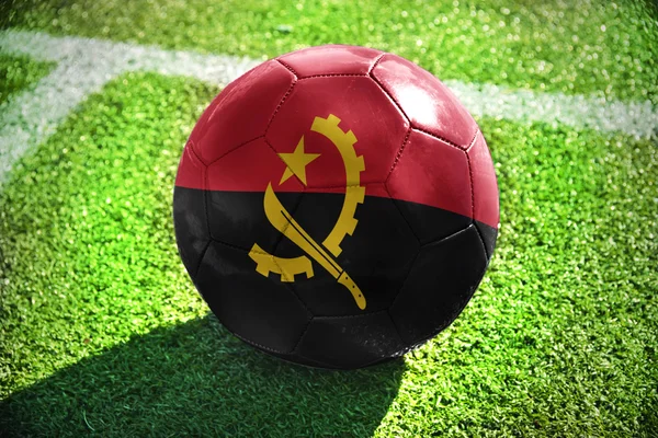 Football ball with the national flag of angola — Zdjęcie stockowe
