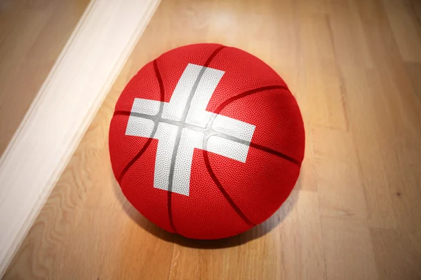 Basketball ball with the national flag of switzerland — Stock Photo, Image