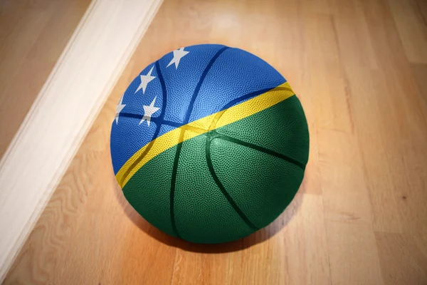 Pelota de baloncesto con la bandera nacional de Islas Salomón —  Fotos de Stock