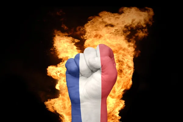 Fire fist with the national flag of france — Stok fotoğraf