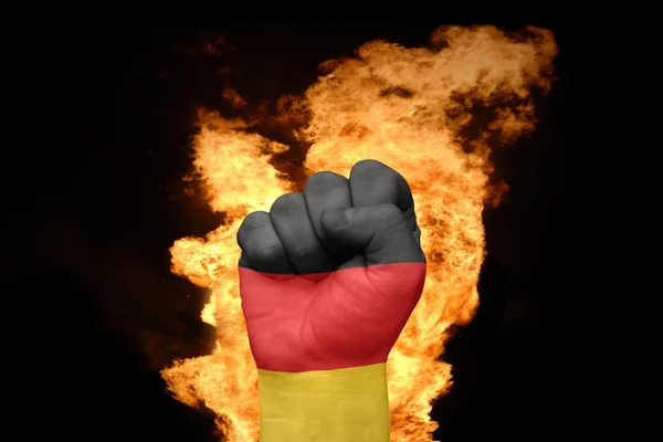 Punho de fogo com a bandeira nacional da alemanha — Fotografia de Stock