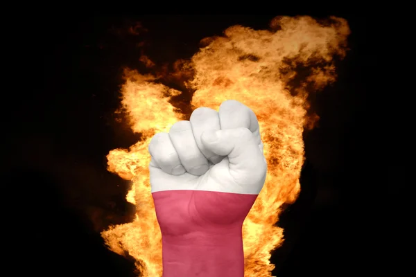 Fire fist with the national flag of poland — ストック写真