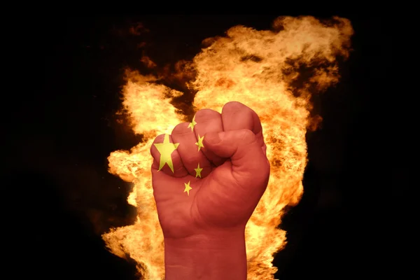 Fire fist with the national flag of china — Stock Photo, Image