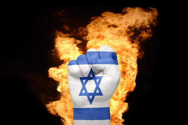 Punho de fogo com a bandeira nacional de israel — Fotografia de Stock