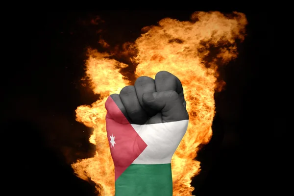 Φωτιά γροθιά με την εθνική σημαία της Ιορδανίας — Φωτογραφία Αρχείου