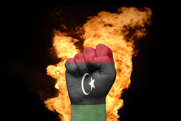 Fire fist with the national flag of libya — Stock Photo, Image