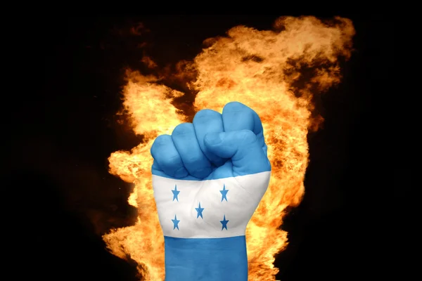 Ogień pięść z Flaga narodowa Hondurasu — Zdjęcie stockowe