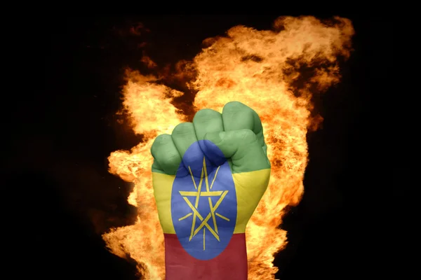 Puño de fuego con la bandera nacional de Etiopía —  Fotos de Stock