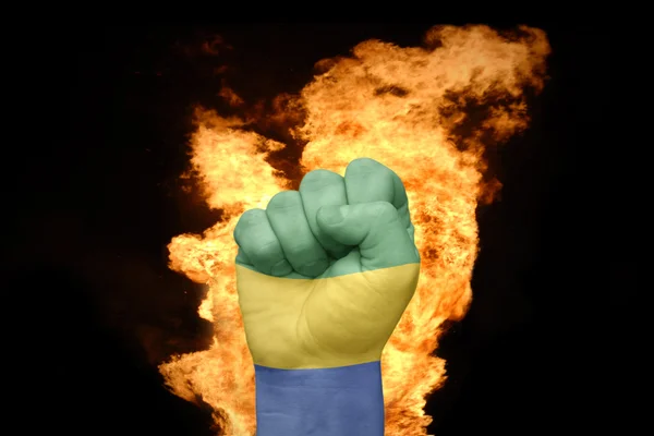 Poing de feu avec le drapeau national du Gabon — Photo