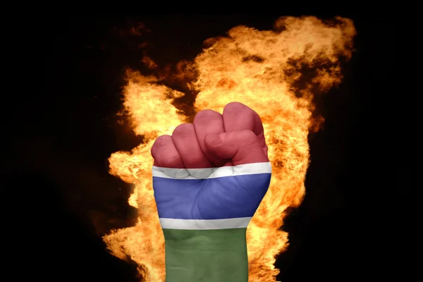 Fire fist with the national flag of gambia — Stock Photo, Image