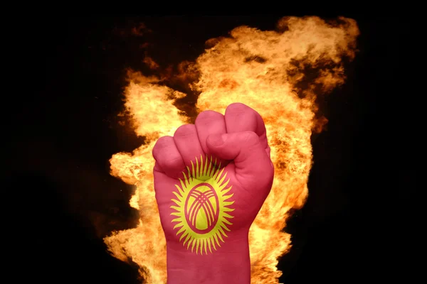 Tűz ököl, Kirgizisztán zászlaja — Stock Fotó
