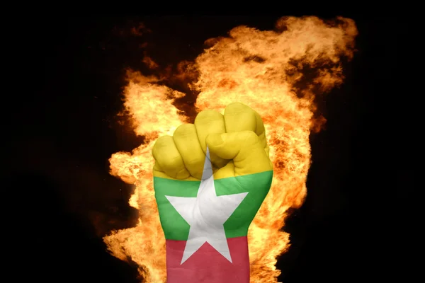 Fire fist with the national flag of myanmar — Stock Photo, Image
