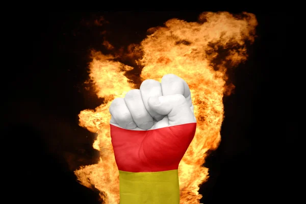 Fire fist with the national flag of south ossetia — Stock Photo, Image