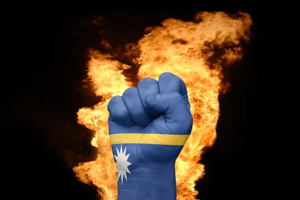 Fire fist with the national flag of nauru — Stock Photo, Image