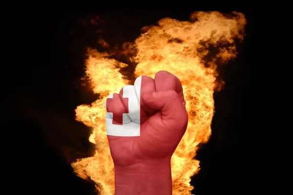 Fire fist with the national flag of tonga — Stock Photo, Image