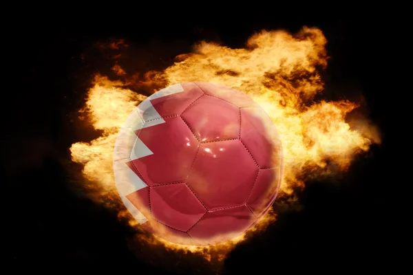 Palla da calcio con la bandiera di bahrain in fiamme — Foto Stock