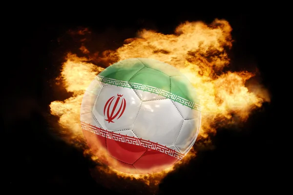 Pallone da calcio con la bandiera di iran in fiamme — Foto Stock