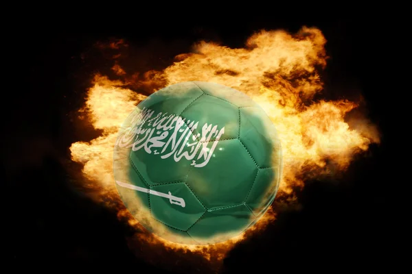 Football ball with the flag of saudi arabia on fire — Stock Photo, Image