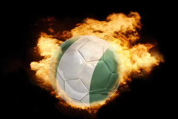 火のナイジェリアの国旗とサッカー ボール — ストック写真